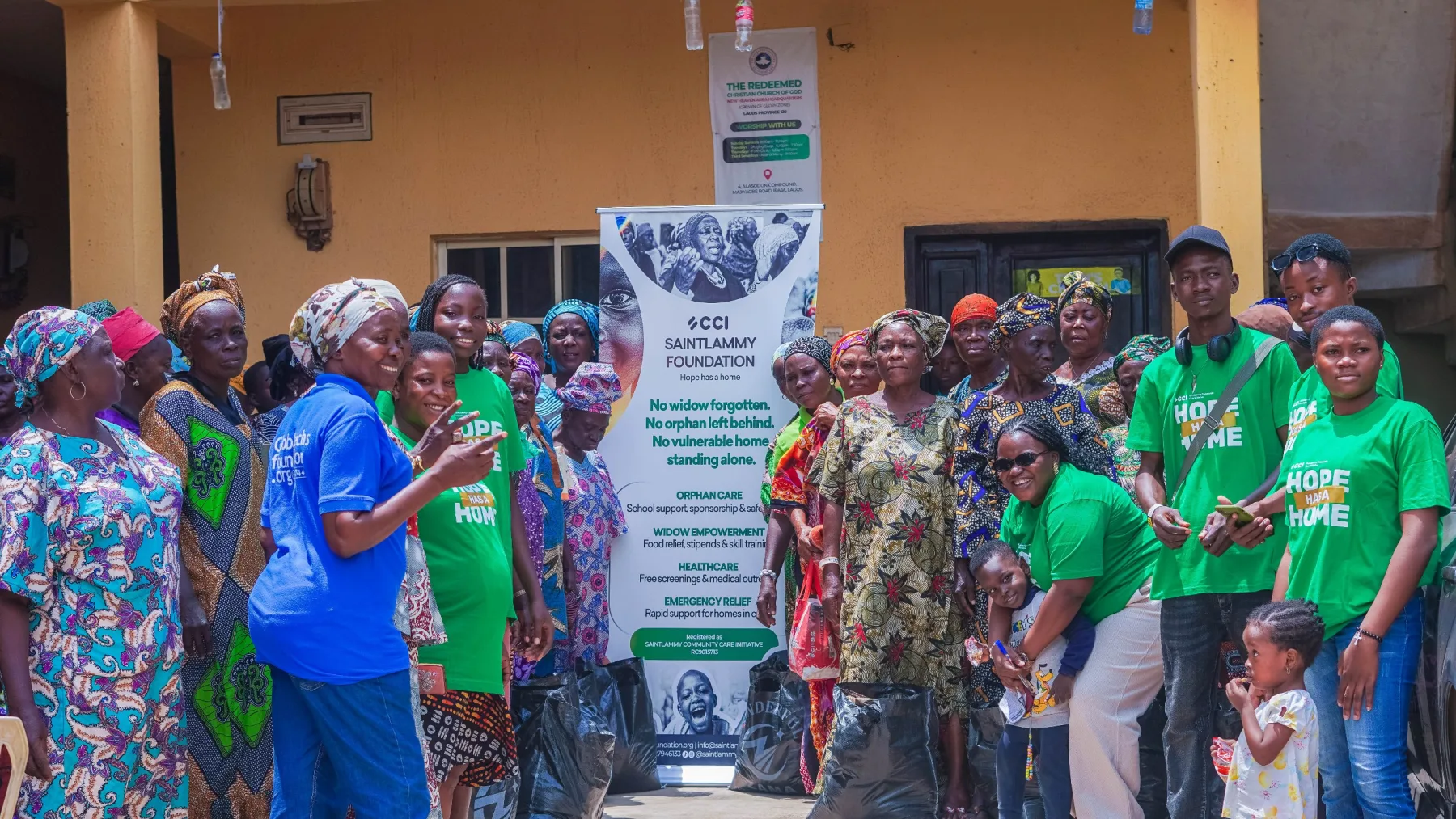 Women gathered with food relief supplies during a Saintlammy Foundation outreach